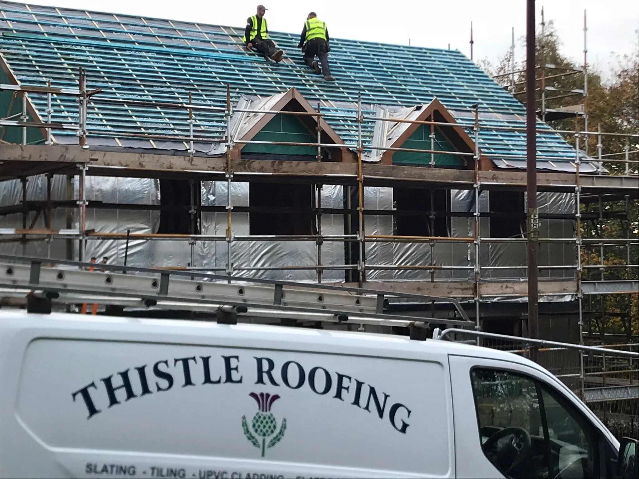 Thistle Roofing team fitting a new roof on a new-build property, membrane and battens visible